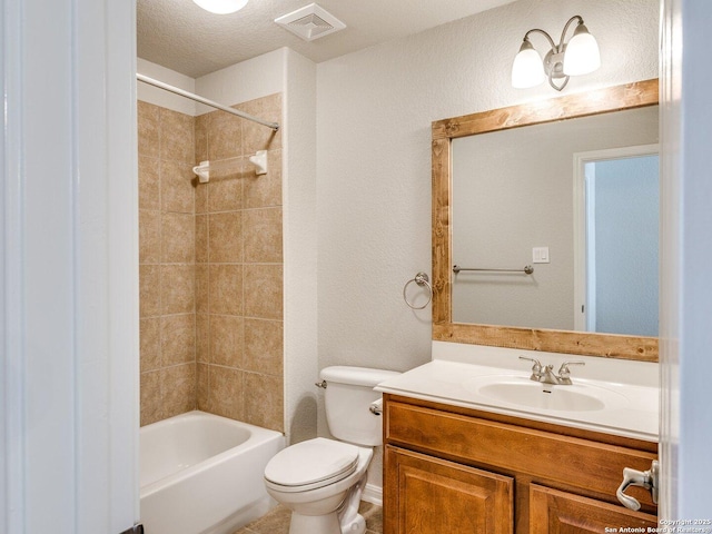 full bathroom featuring visible vents, a textured wall, toilet, vanity, and shower / bathtub combination