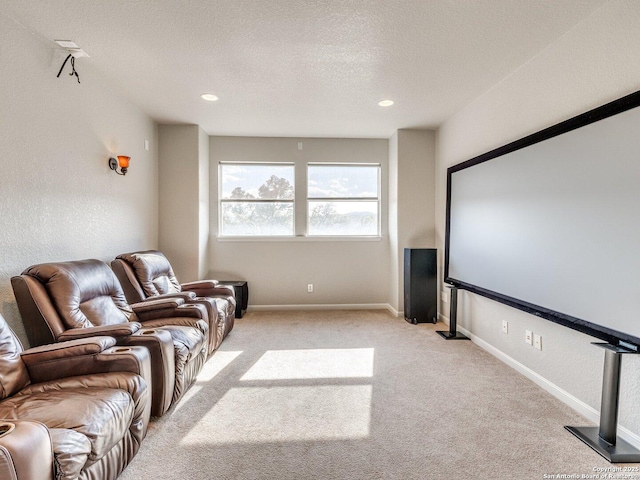 cinema featuring recessed lighting, light colored carpet, a textured ceiling, and baseboards