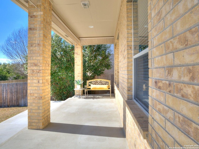 view of patio / terrace featuring fence