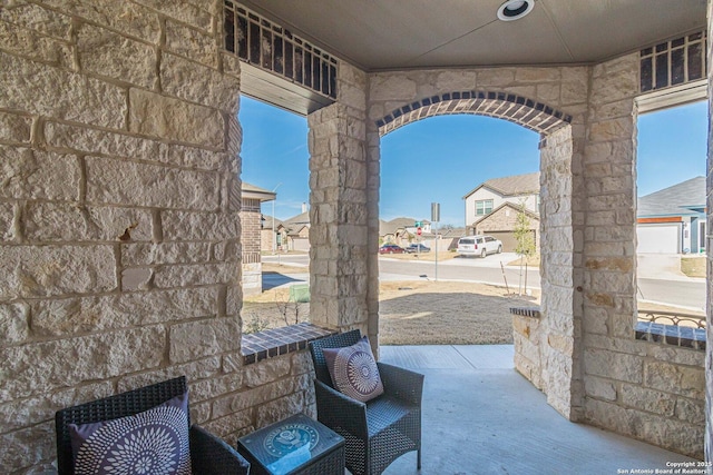 view of patio / terrace featuring a residential view and covered porch