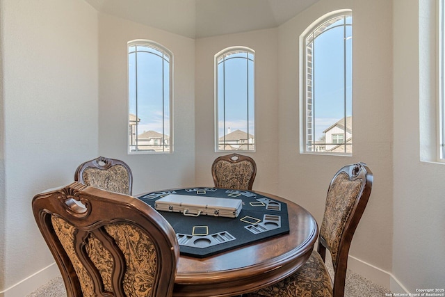 dining space featuring baseboards