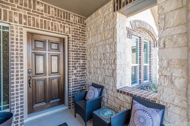 entrance to property with brick siding