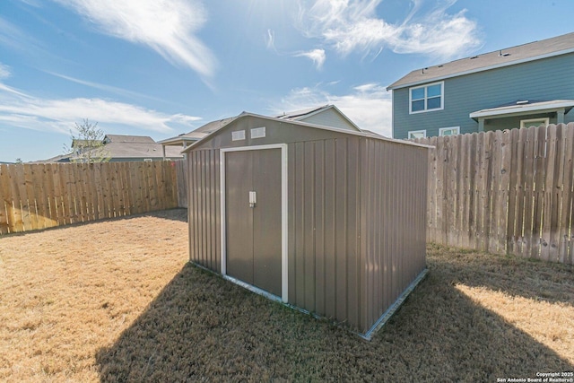 view of shed featuring a fenced backyard