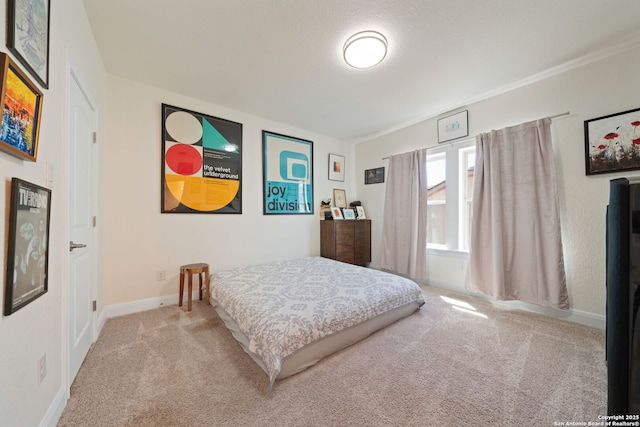 carpeted bedroom with baseboards