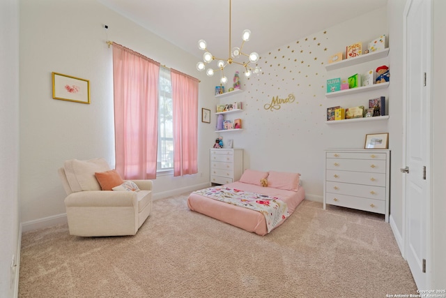 bedroom with carpet floors, baseboards, and a chandelier