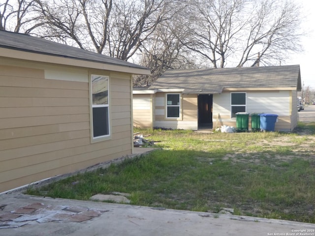 view of home's exterior featuring a yard