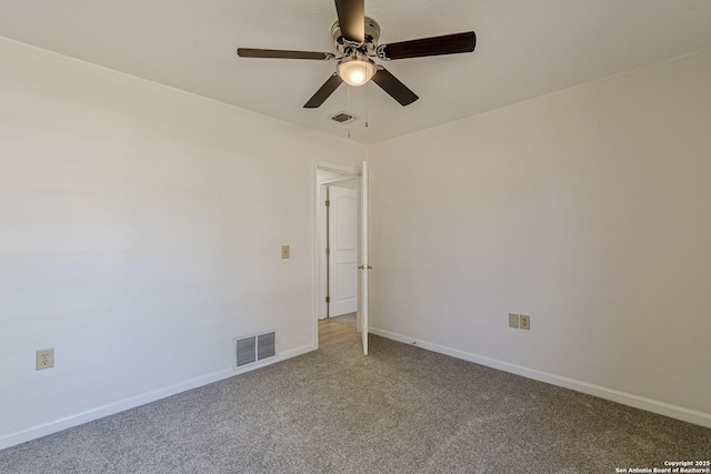 unfurnished room featuring visible vents, light carpet, and baseboards