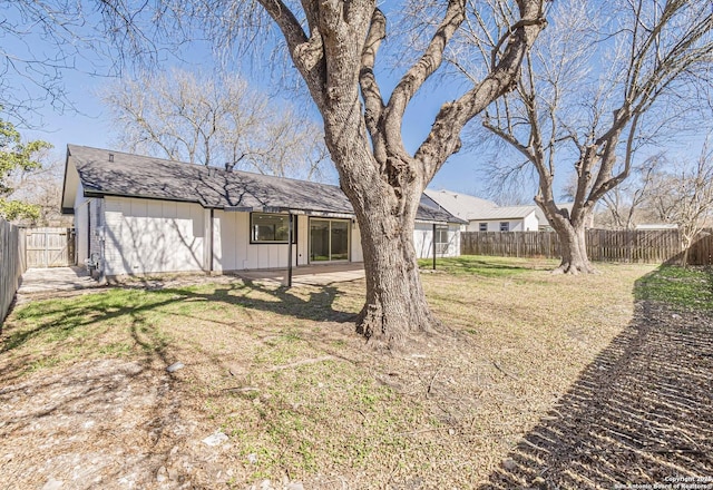 view of yard featuring a patio and a fenced backyard