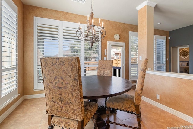 dining area featuring light tile patterned floors, visible vents, baseboards, and ornate columns