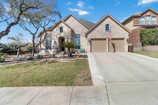 view of front of home featuring a front yard, concrete driveway, and brick siding