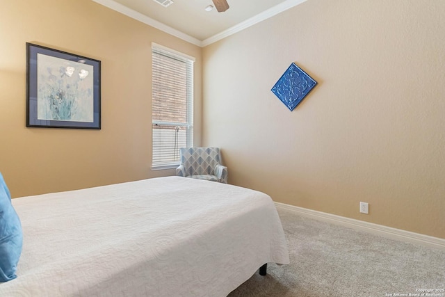 carpeted bedroom featuring ceiling fan, ornamental molding, visible vents, and baseboards