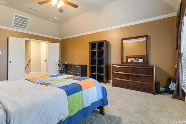 carpeted bedroom featuring visible vents, vaulted ceiling, and crown molding