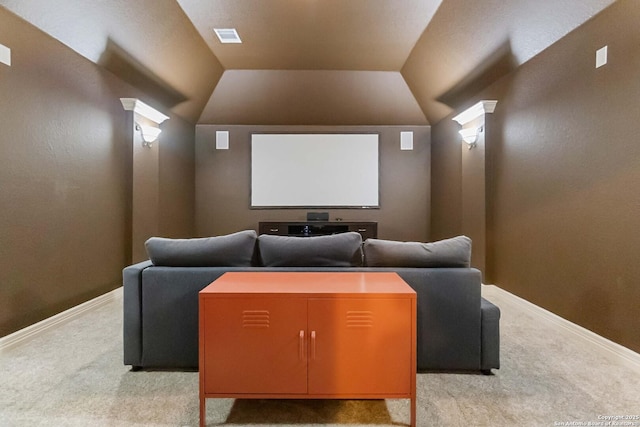 home theater room featuring visible vents, baseboards, and light colored carpet