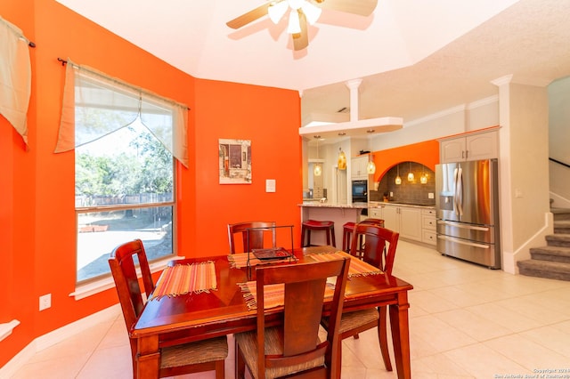 dining space featuring stairs, light tile patterned floors, a ceiling fan, and baseboards