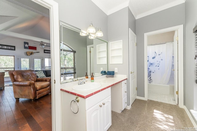 ensuite bathroom featuring vanity, ornamental molding, wood finished floors, shower / bath combination with curtain, and french doors