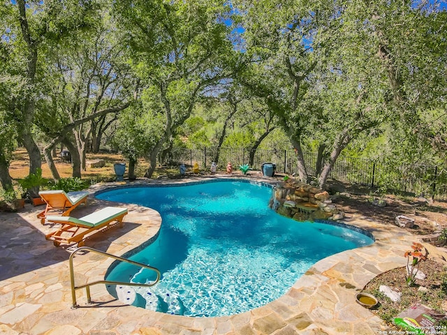 view of pool with a fenced backyard, a fenced in pool, and a patio