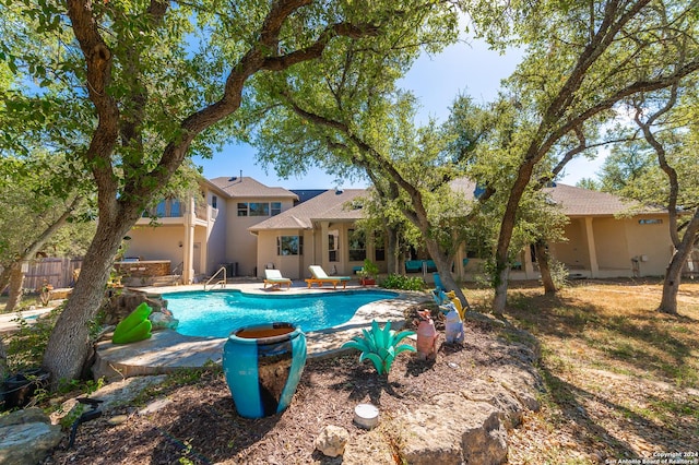 pool featuring a patio and fence