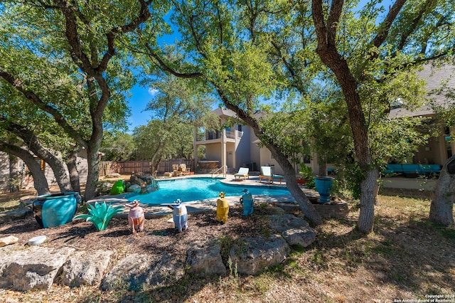 view of pool featuring a fenced in pool, a patio area, and fence