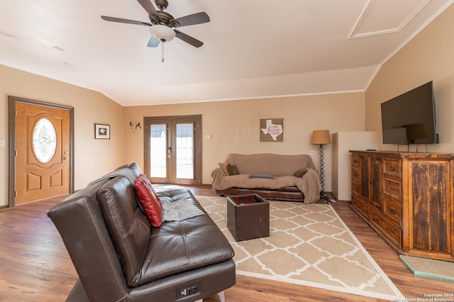 living room with vaulted ceiling, ceiling fan, french doors, and wood finished floors