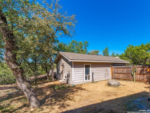 exterior space with a fenced backyard