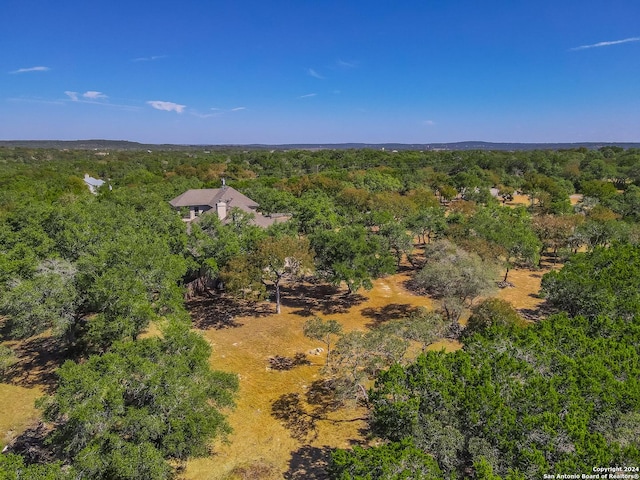 birds eye view of property with a wooded view