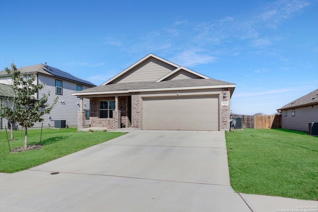 view of front facade featuring brick siding, a front lawn, an attached garage, and fence