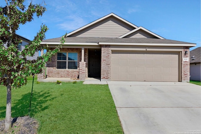 view of front of property featuring a front yard, brick siding, driveway, and an attached garage