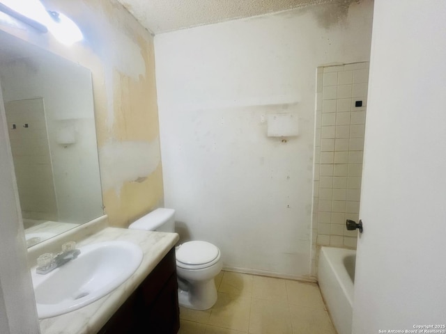 bathroom with baseboards, vanity, toilet, and tile patterned floors