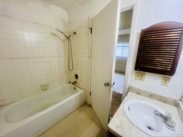 bathroom with shower / tub combination, vanity, and tile patterned floors