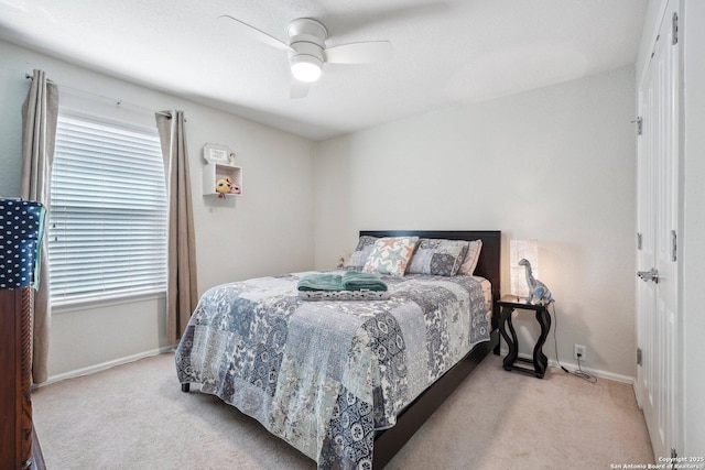 bedroom featuring carpet floors, a ceiling fan, and baseboards