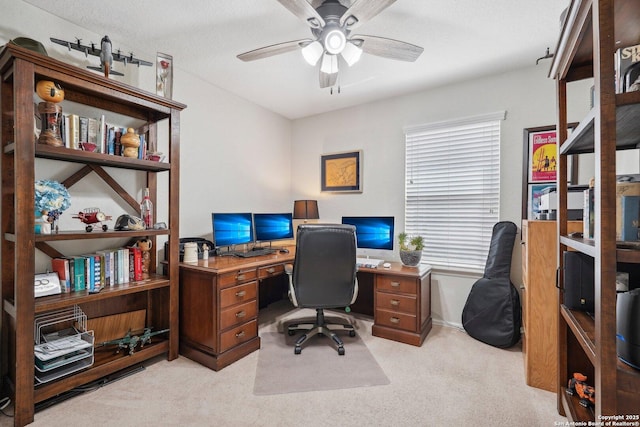 office area with light carpet and ceiling fan