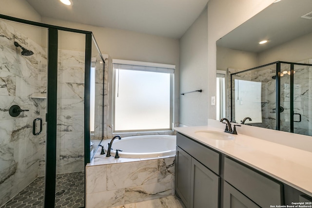 bathroom featuring a marble finish shower, visible vents, recessed lighting, a bath, and vanity