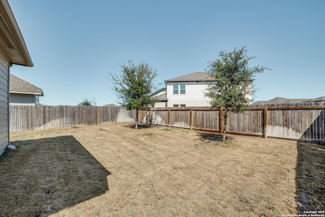 view of yard featuring a fenced backyard