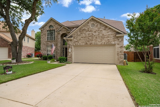 4637 Red Rock Pass, Schertz, TX 78154 - traditional home featuring a front lawn, driveway, brick siding, and a garage