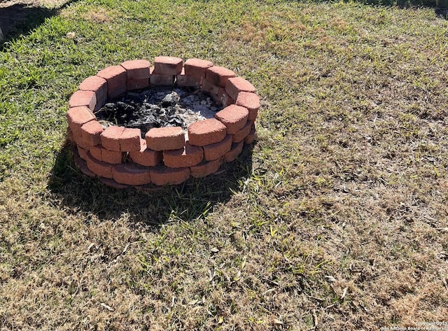 exterior details with an outdoor fire pit