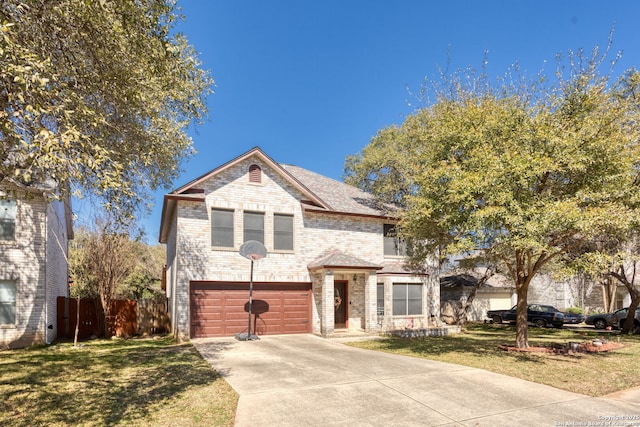 view of front of home with an attached garage, brick siding, fence, concrete driveway, and a front lawn