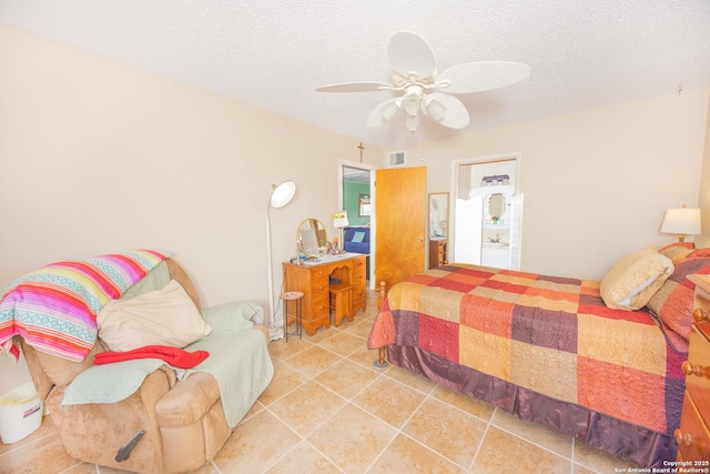 tiled bedroom with ceiling fan, visible vents, and a textured ceiling