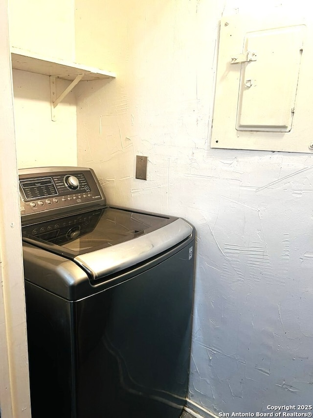 laundry area with laundry area, washer / clothes dryer, and electric panel