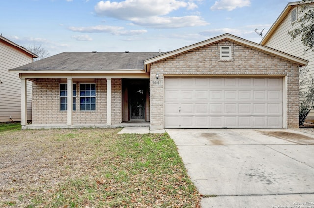 single story home featuring concrete driveway, brick siding, a front lawn, and an attached garage