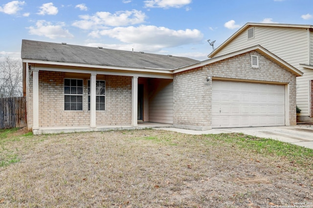 ranch-style house featuring an attached garage, brick siding, fence, concrete driveway, and a front lawn