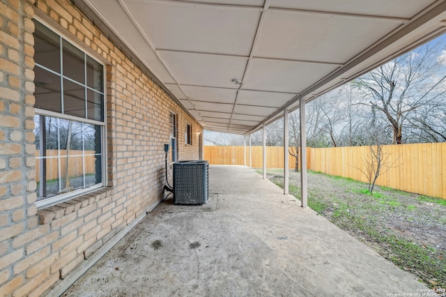 view of patio with a fenced backyard and cooling unit