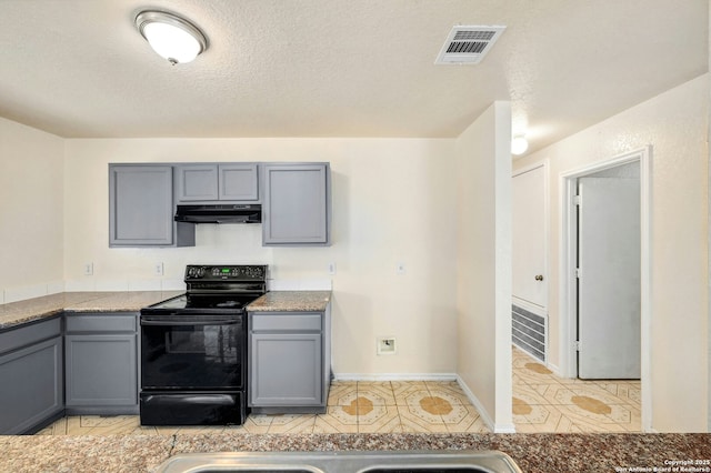 kitchen with visible vents, black electric range oven, under cabinet range hood, and gray cabinetry