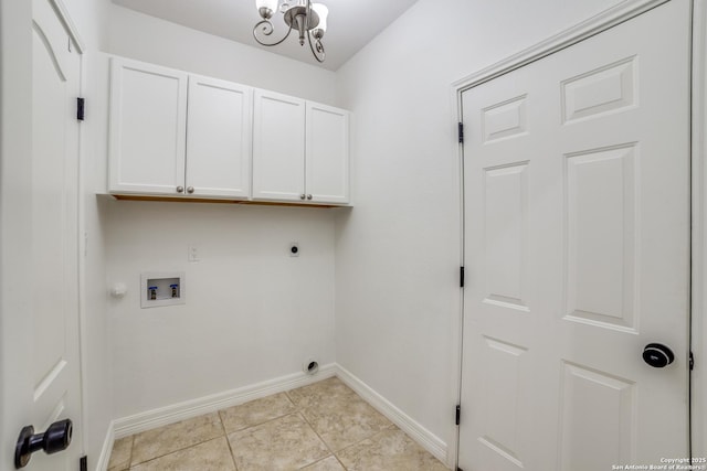 clothes washing area with washer hookup, light tile patterned floors, cabinet space, hookup for an electric dryer, and baseboards