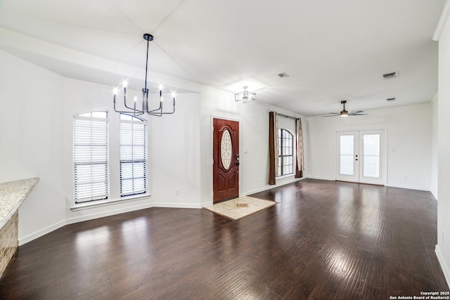 foyer with dark wood-style floors, baseboards, visible vents, and french doors