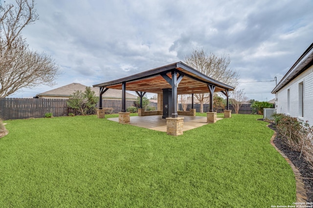 view of yard featuring a fenced backyard, a patio, central AC, and a gazebo