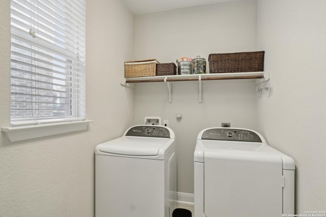 washroom featuring laundry area and washer and clothes dryer