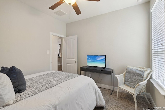 bedroom with carpet, baseboards, visible vents, and ceiling fan