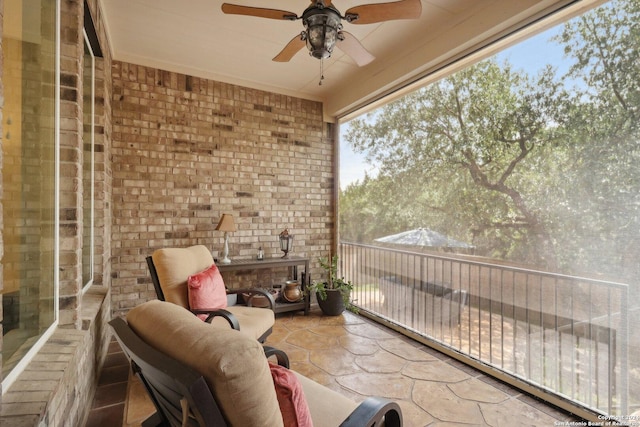 balcony featuring a ceiling fan