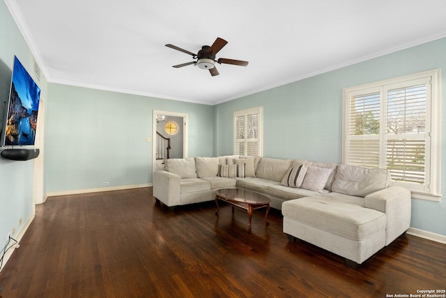 living room featuring crown molding, wood finished floors, a ceiling fan, and baseboards