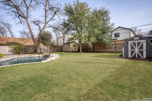 view of yard featuring a shed, an outdoor structure, a fenced backyard, and a fenced in pool